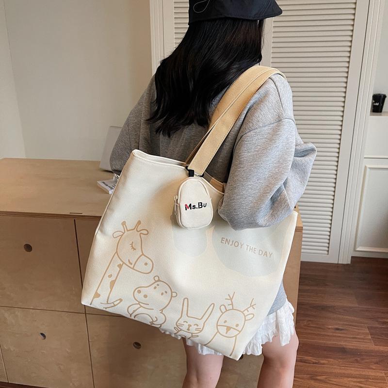 2025 Autumn New Leisure Commuter Large-capacity Canvas Bag Women's Niche Shoulder Bag Graffiti Portable Tote Bag
