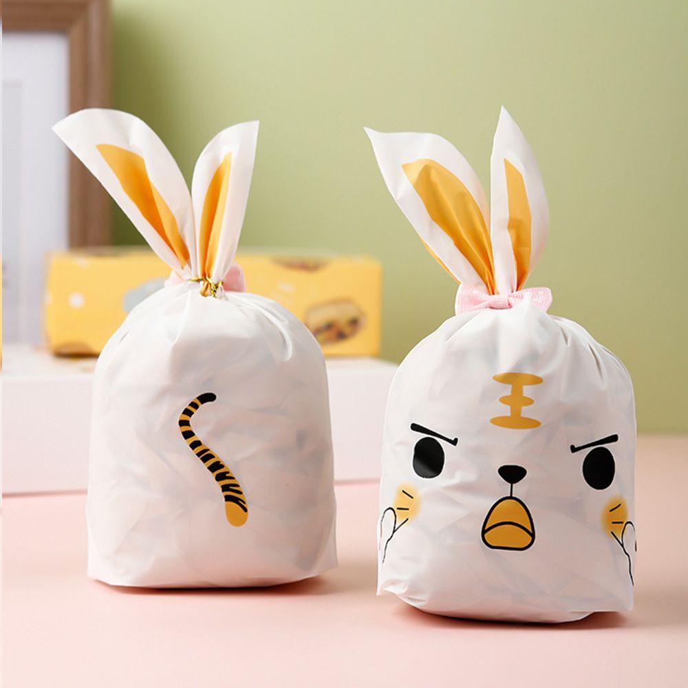 50 шт. Новые пасхальные картонные мешочки с ушками кролика, пластиковые мешочки для конфет в виде животных для детей, упаковка для печенья на день рождения, подарки своими руками