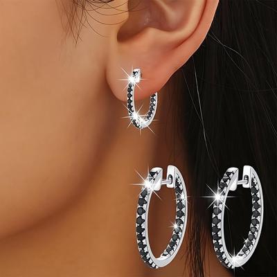 Элегантные серьги кольца инкрустированные черной шпинелью