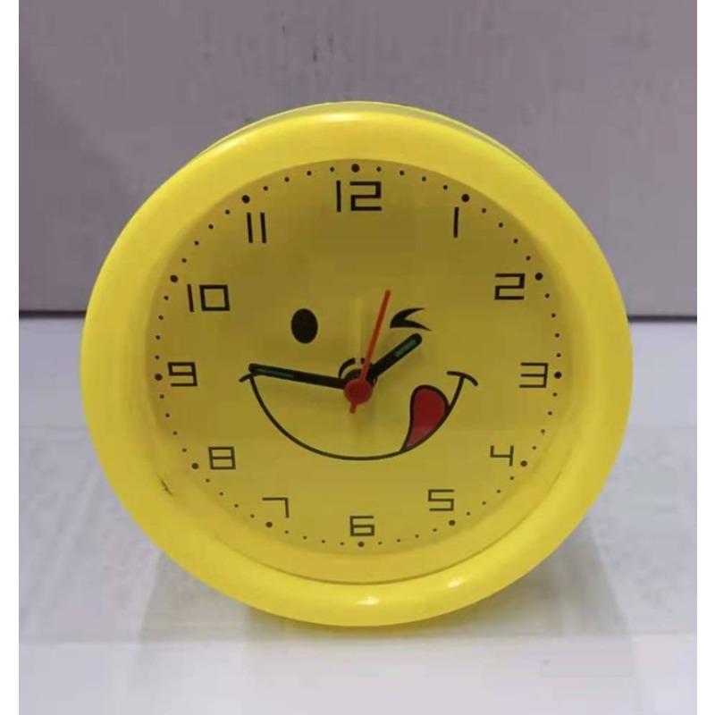 Round, Multiple Smiling Faces and Small Alarm Clock