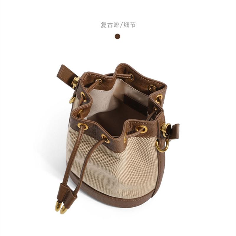 Niche design bucket bag women's 2025 new trendy high-end sense of work small bag portable messenger canvas bag