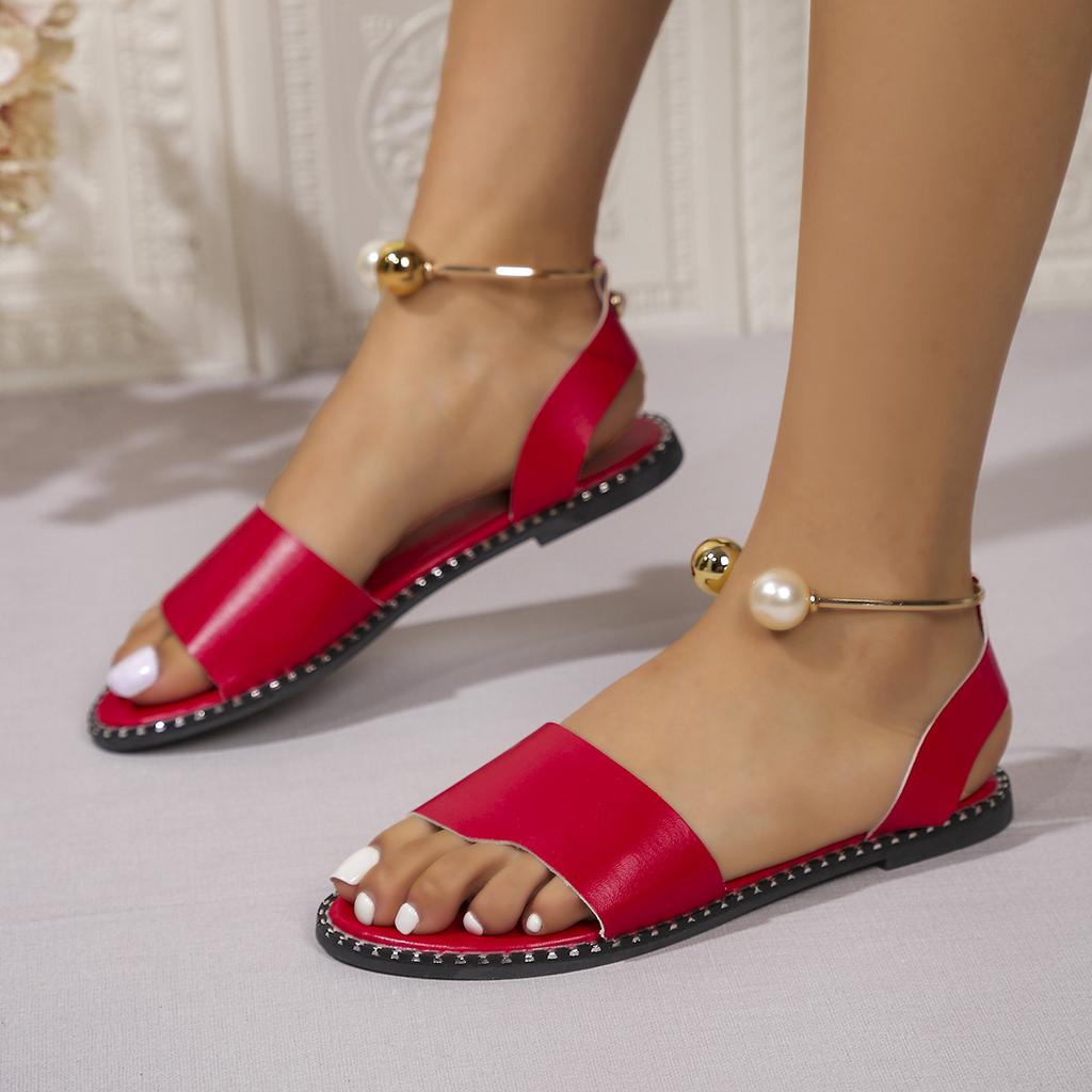 European and American one-word buckle flat sandals women's new open-toed simple pearl metal buckle cool slippers
