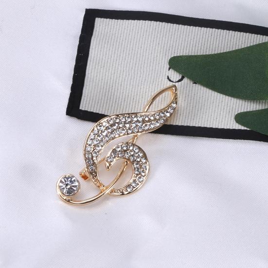 Креативная женская брошь в форме музыкальной ноты, блестящие стразы, инкрустированная булавка, платье, костюм, шаль с лацканами, значок, пальто, аксессуары