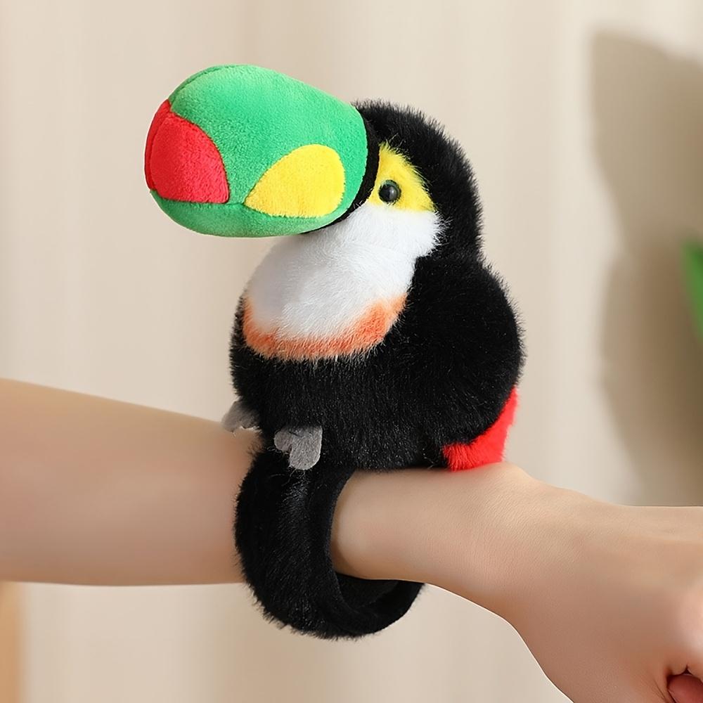 Cute parrot plush wristband with snap closure. Colorful bird-shaped wearable toy for kids, lovely collectible accessory.