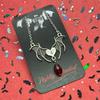 Gothic Bat Wings Necklace with Heart, Cross, and Red Glass Accents