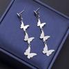 Korean Fashion Metal Butterfly Tassel Earrings - High-End Dynamic Christmas Jewelry for Women