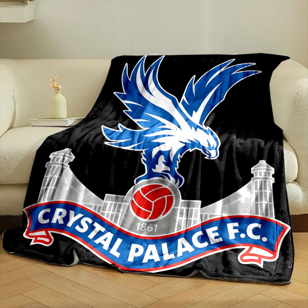 A blue eagle atop a red football, with a palace structure in the background. for all seasons blanket lunch break throw gift