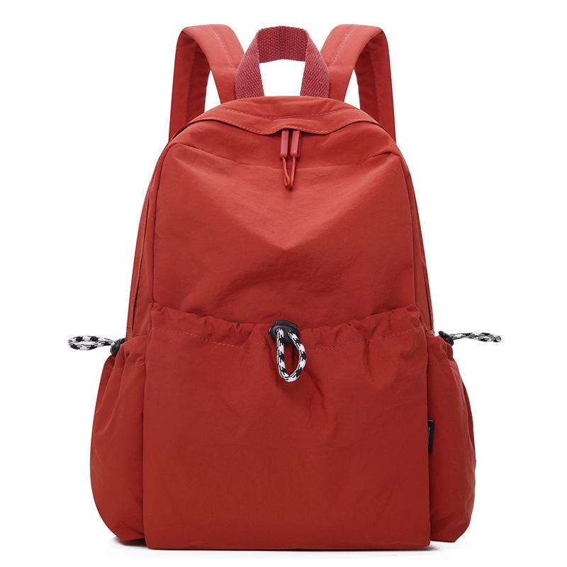 Корейский женский нейлоновый рюкзак весна-лето 2025: Модный однотонный повседневный школьный ранец для студентов