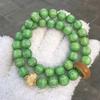 Green Bodhi Root & Ivory Nut Mantra Bracelet with Awakening Lion Charm - Unisex