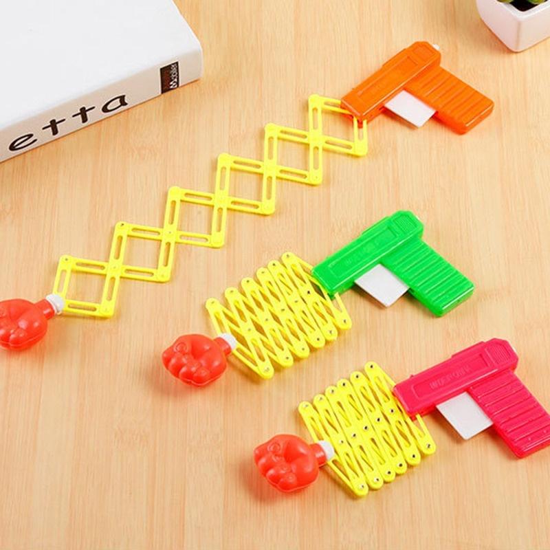 Выдвижной кулак-шутер, игрушечный пистолет, забавные детские игрушки для розыгрышей, детский пластиковый праздничный подарок для развлечения, классический эластичный телескопический кулак