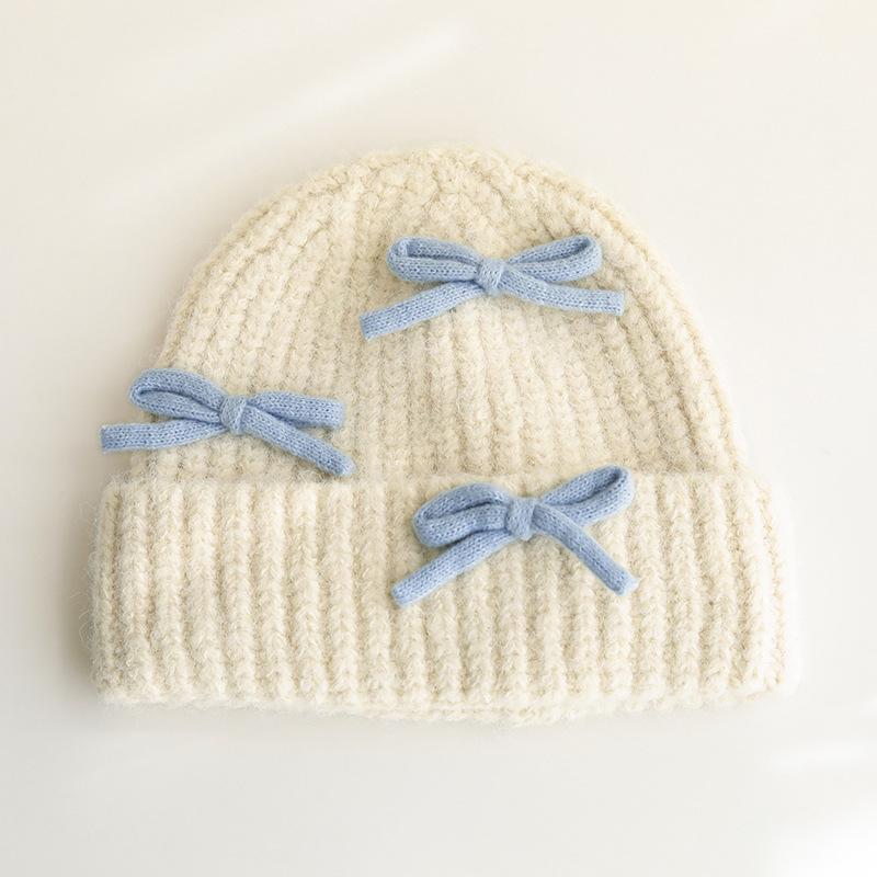 Вязаная шерстяная шапка с бантом для женщин на осень и зиму, теплая и универсальная, утолщенная защита ушей, шапка, подчеркивающая маленькое лицо