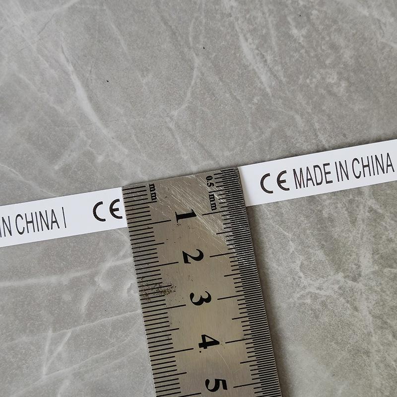 Этикетка для стирки нетканого материала с маркировкой CE - белый фон, черный текст