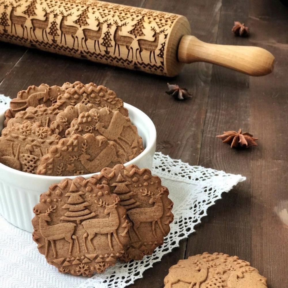 Wooden rolling pin with Christmas patterns and decorative engraving