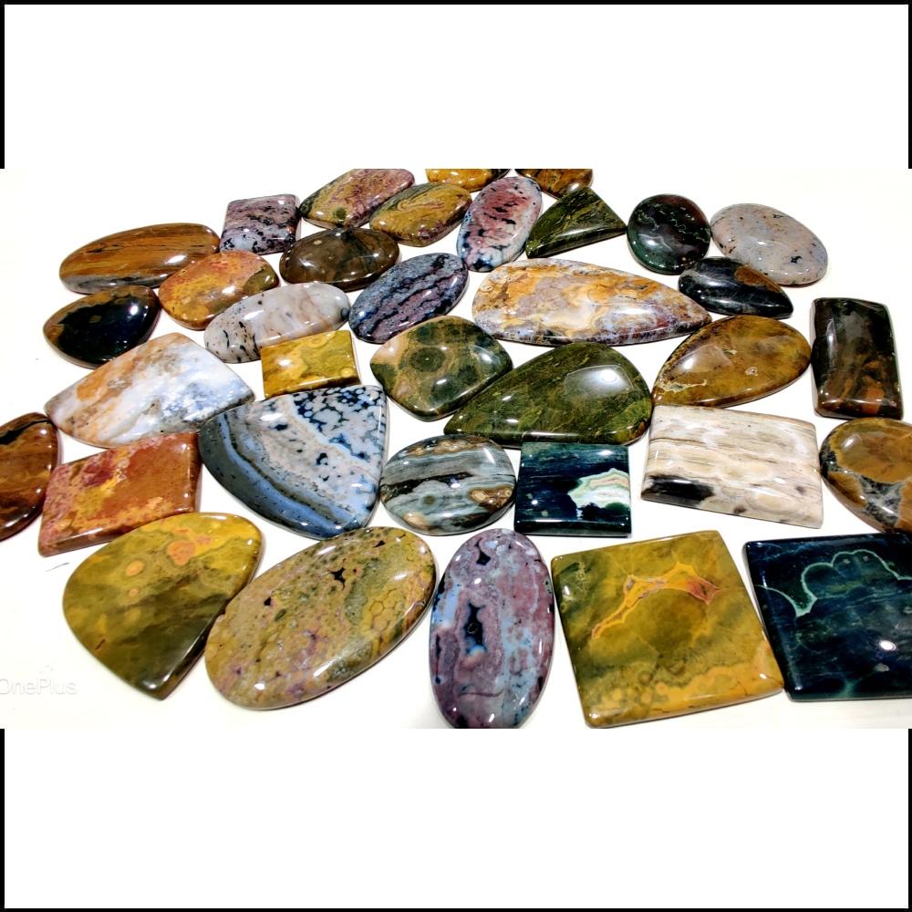 Натуральный кабошон из океанской яшмы. Партия кабошонов из океанской яшмы по весу, разных форм и размеров, используемых для изготовления ювелирных изделий.