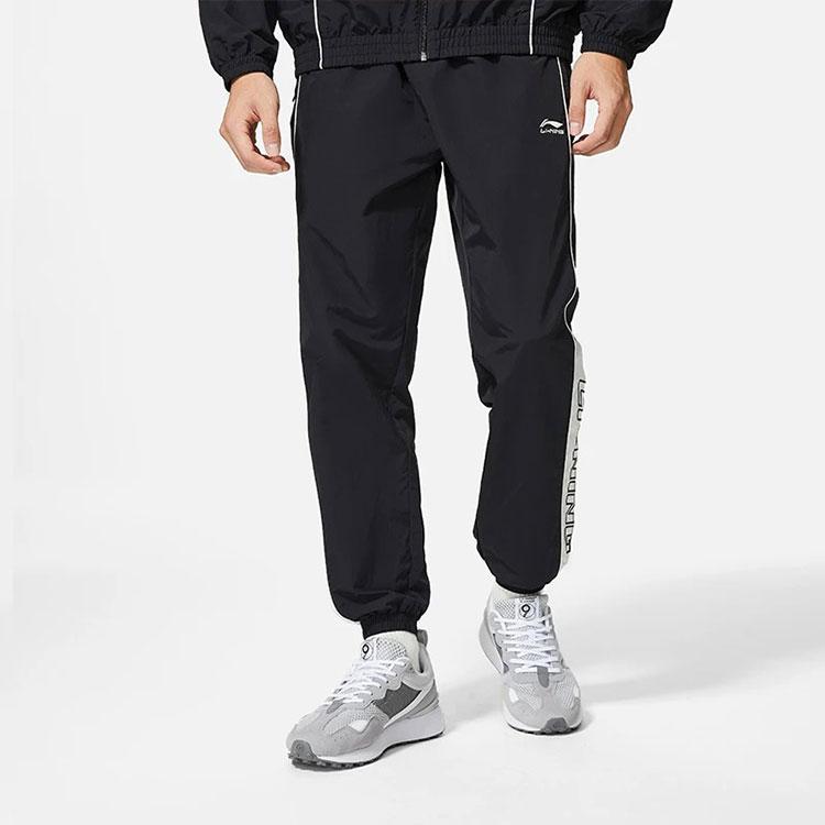 Li-Ning Модные цветные свободные зауженные трикотажные спортивные штаны мужские низы черного цвета AYKS837-3