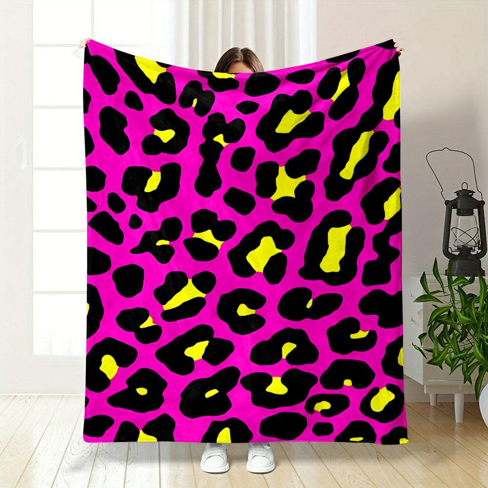 Bold leopard print with black spots, yellow centers, on a pink background. for all seasons blanket lunch break throw gift