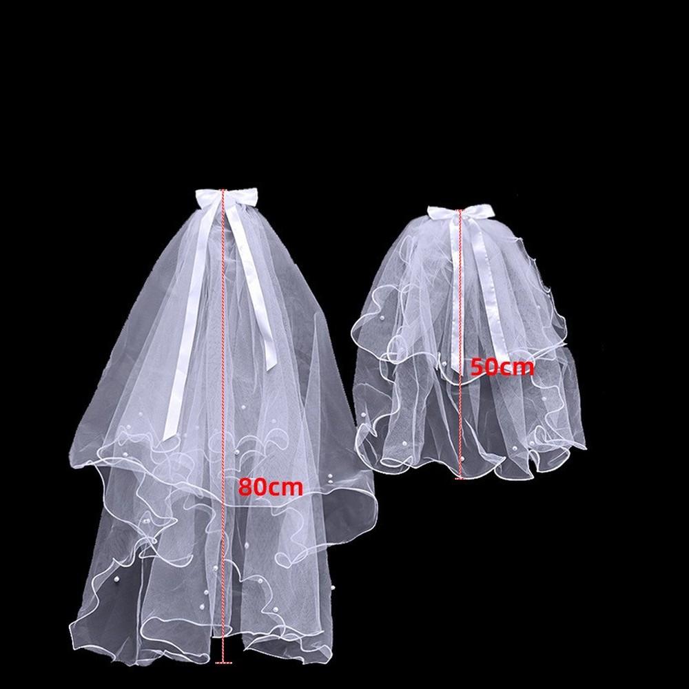 Завитая двухслойная вуаль с жемчужным бантом