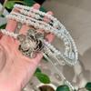 многослойное жемчужное ожерелье с кисточками и камелией