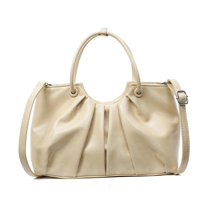 Корейская версия нишевой дизайнерской плиссированной сумки в иностранном стиле, женская универсальная сумка-мессенджер для通勤 из масляной вощеной кожи с чувством стиля