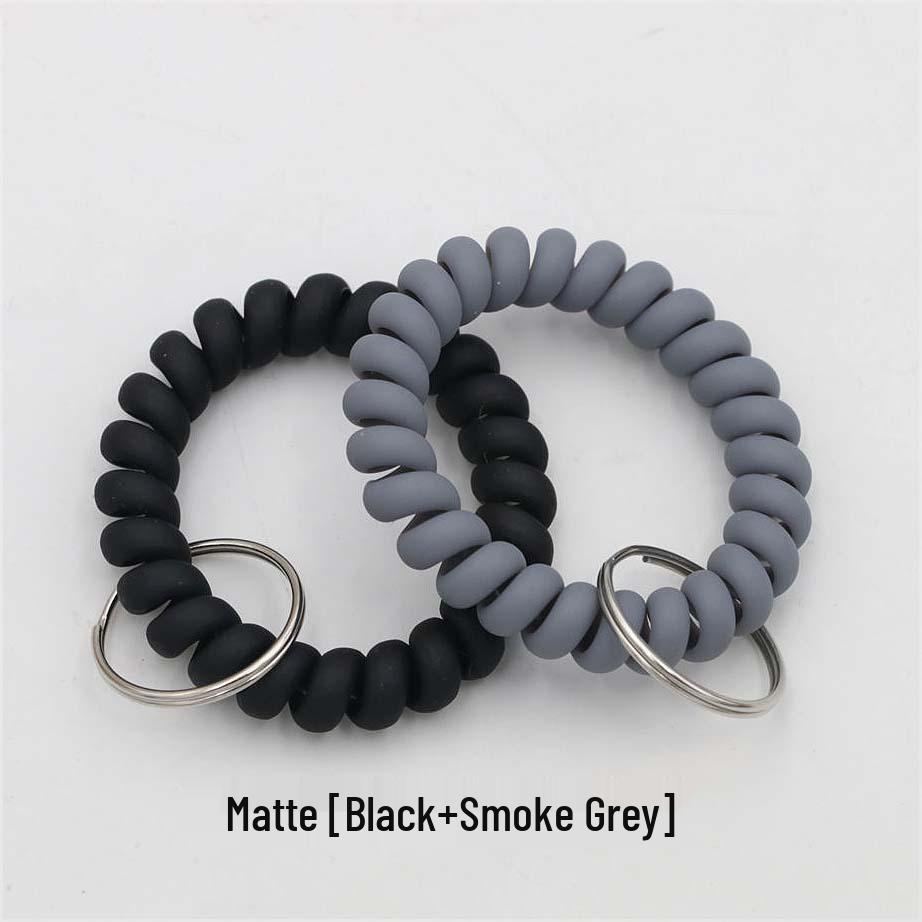 Минималистичный браслет-брелок и резинка для волос в виде пружинного механизма