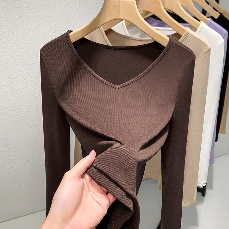 Рубашка с резьбой по низу женская 2025 новая европейская женская одежда темпераментный V-образный вырез футболка с длинным рукавом эластичный внутренний пояс топ