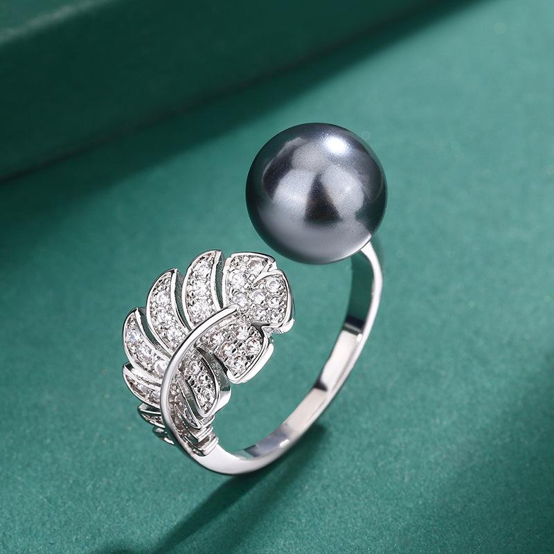 Imitation natural freshwater pearl feather ring European and American S111 silver needle earrings zircon Tahiti necklace women's