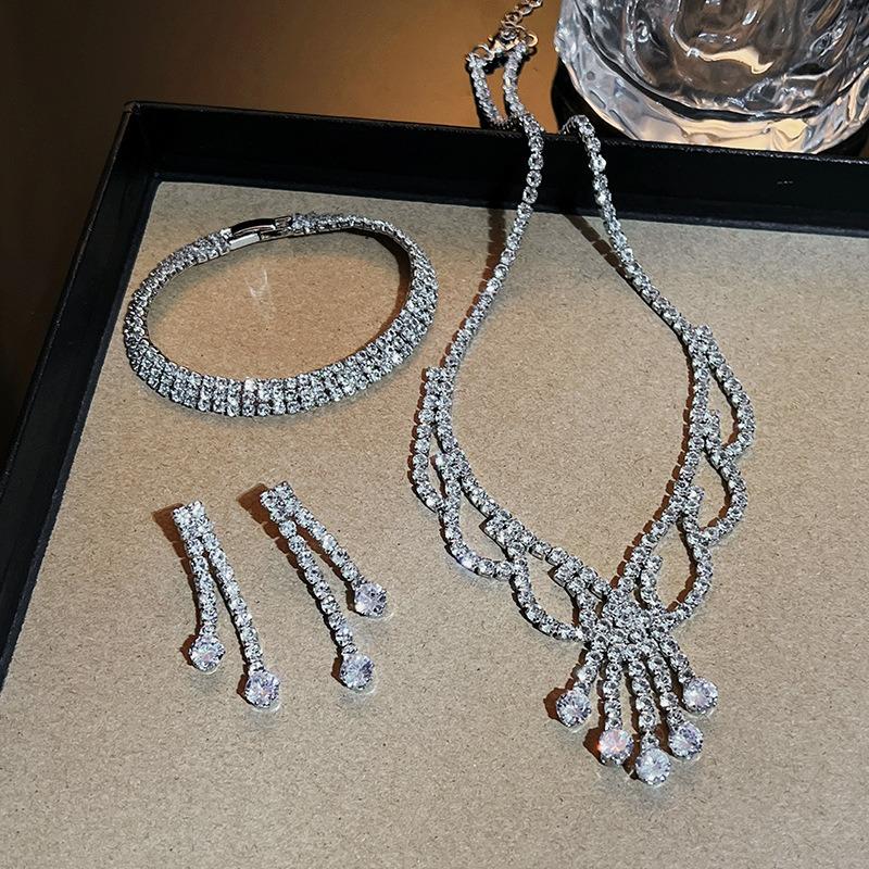 Elegant necklace, bracelet, and earring set - bridal jewelry with full diamond accents
