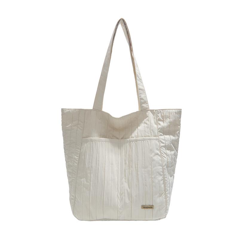 Лето 2025 новая сумка-тоут с плиссированной плечевой лямкой, простая и модная однотонная сумка для поездок в иностранном стиле, большая вместимость