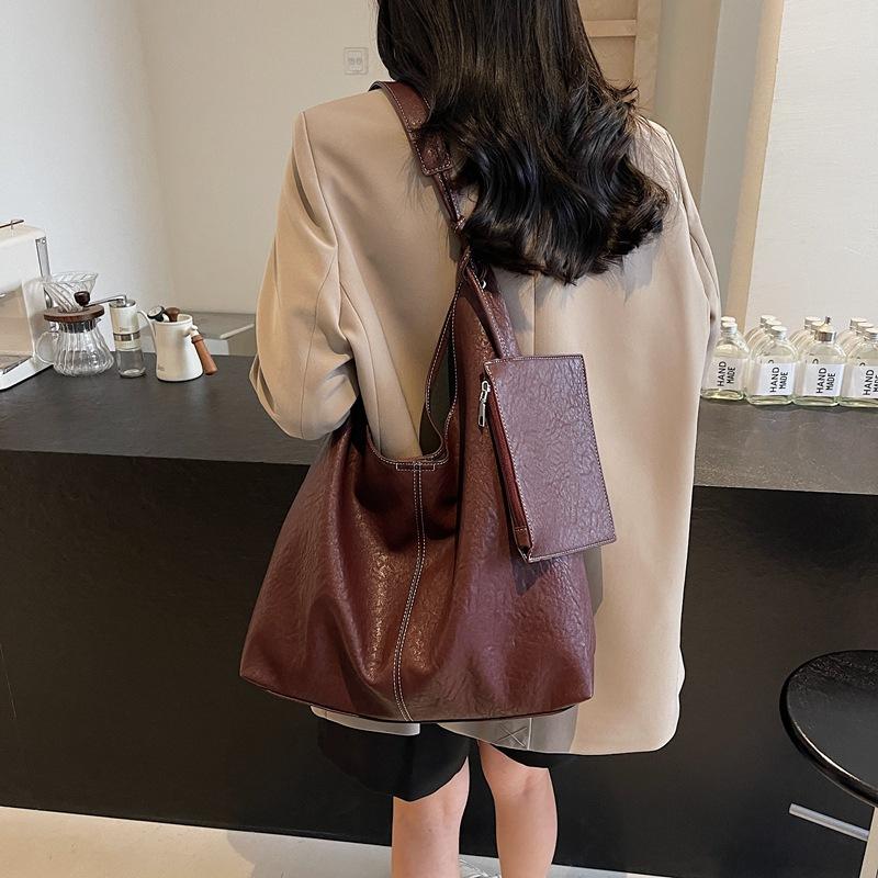 2025 новая высококачественная сумка-тоут на плечо из мягкой кожи, вместительная повседневная сумка-ведро, ленивая кроссбоди, для通勤, под мышку