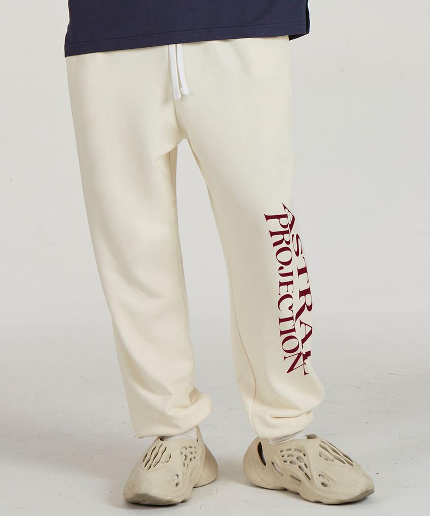 ASTRAL PROJECTION Lettering Logo Comfortable Training Sweat Jogger Pants_Cream