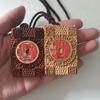 Red Sandalwood Jujube Mountain Ghost Flower Coin Pendant with Inlaid Yatsuhashi and Bagua Safety Charm.