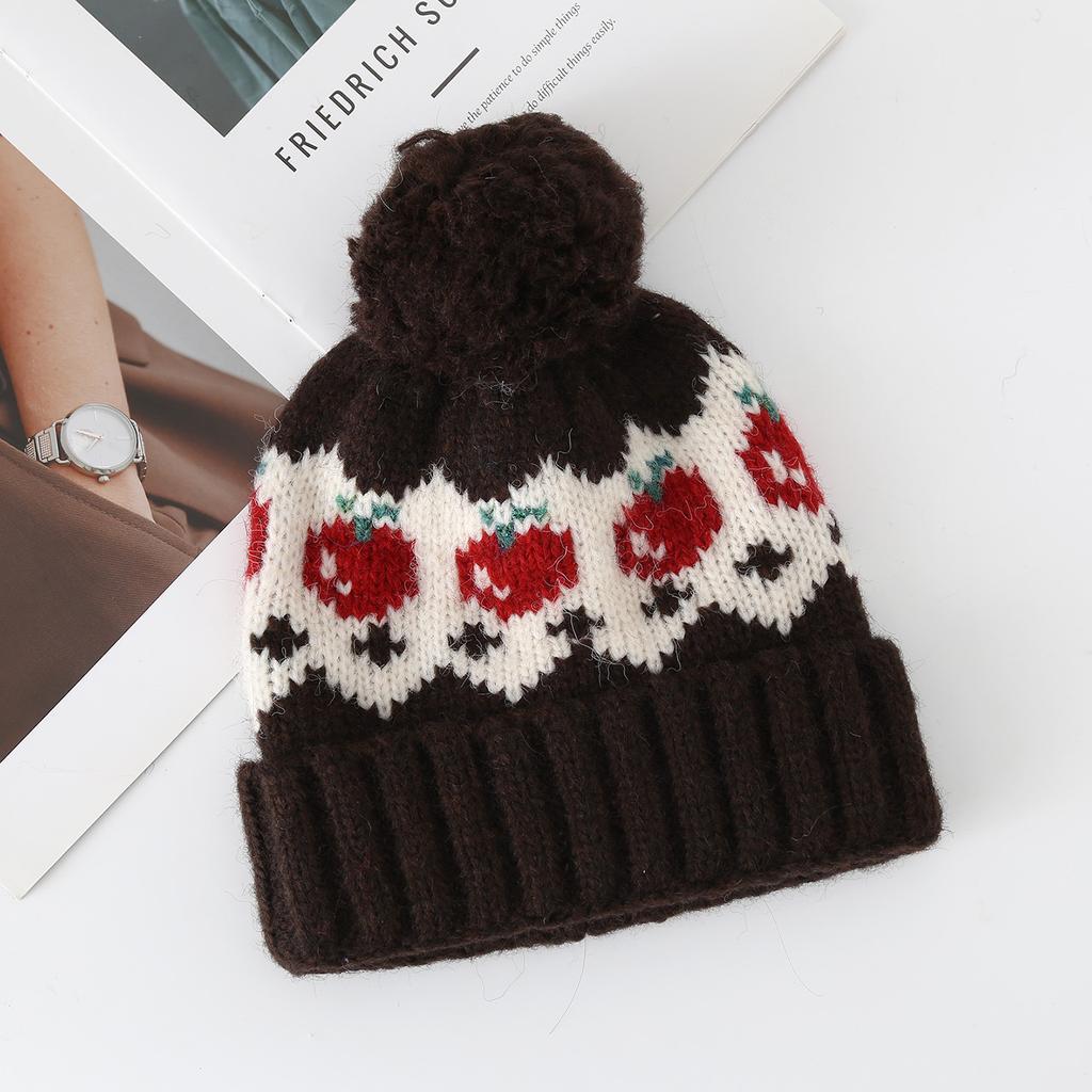 Fair Island wind red strawberry hairball wool hat women's autumn and winter cute cold and warm mountaineering ear protection knitted hat