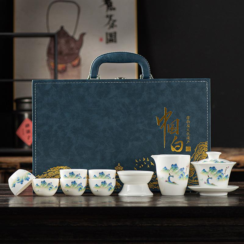 Suet jade white porcelain kung fu tea set, a complete set of gift boxes, office tea tasting cup cover bowl business souvenir