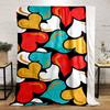 Colorful heart shapes in red, yellow, white, and blue on a black background. for all seasons blanket lunch break throw gift