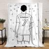 A person wearing a jersey labeled "RONALDO" with "7" surrounded by confetti. for all seasons blanket lunch break throw gift