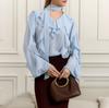 1116 spring and summer new product comfortable V-neck ruffle edge long-sleeved loose shirt European and American design sense commuter versatile top