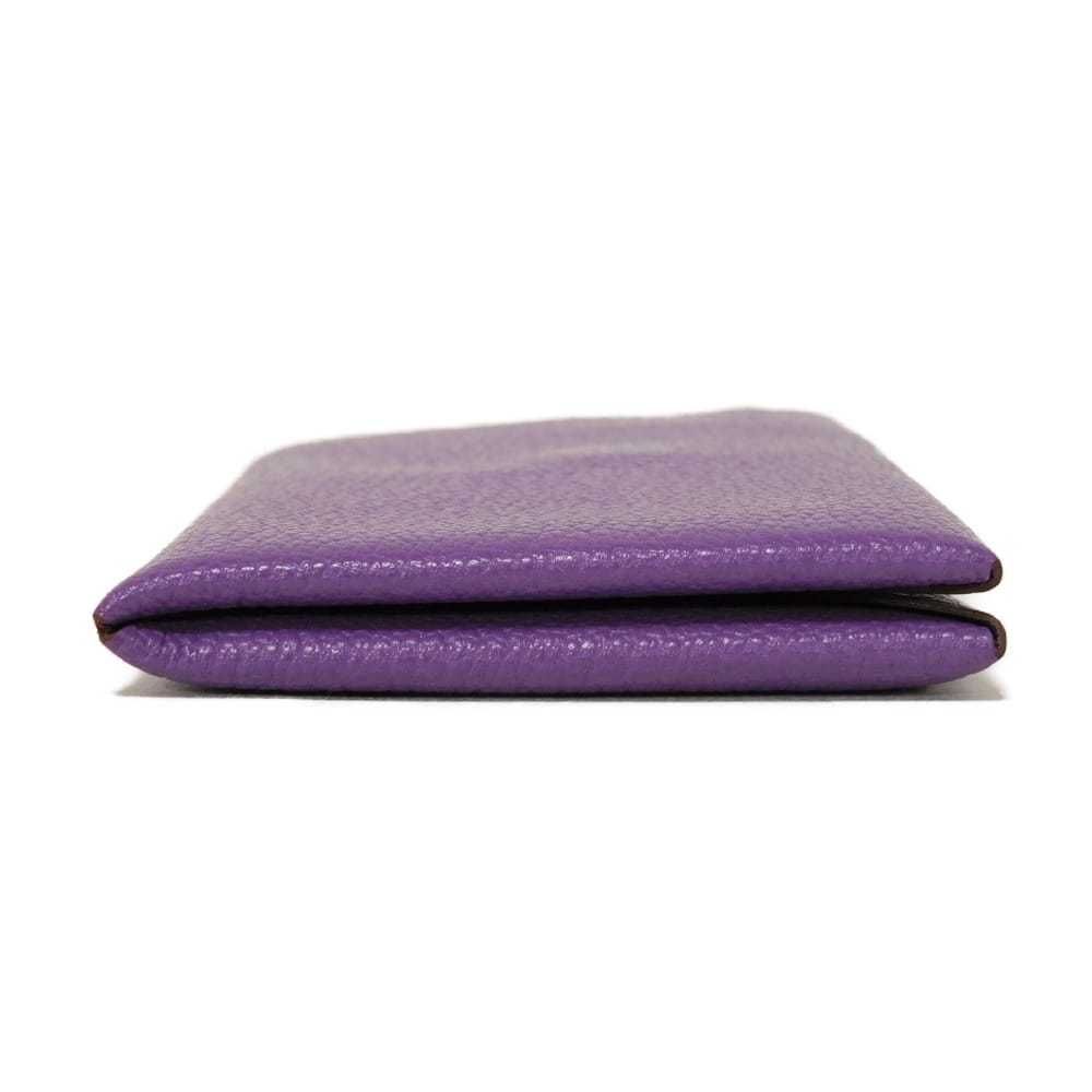 Used 9212 Calvi 7946 Chevre Mysore goatskin bag with gold-stamped logo and purple snap buttons. Excellent condition.