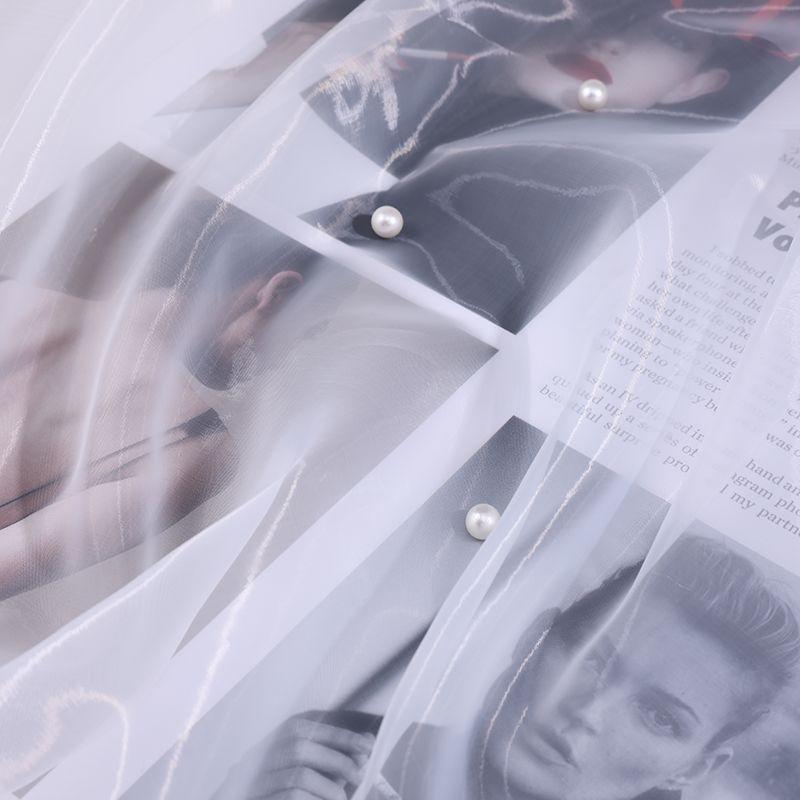The thickened and encrypted soft light organza fabric can be used for wedding dresses evening gowns and designer clothing fabric