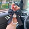 Elegant Pearl Bow Keychain: Fashionable Women's Bag Pendant and Car Accessory