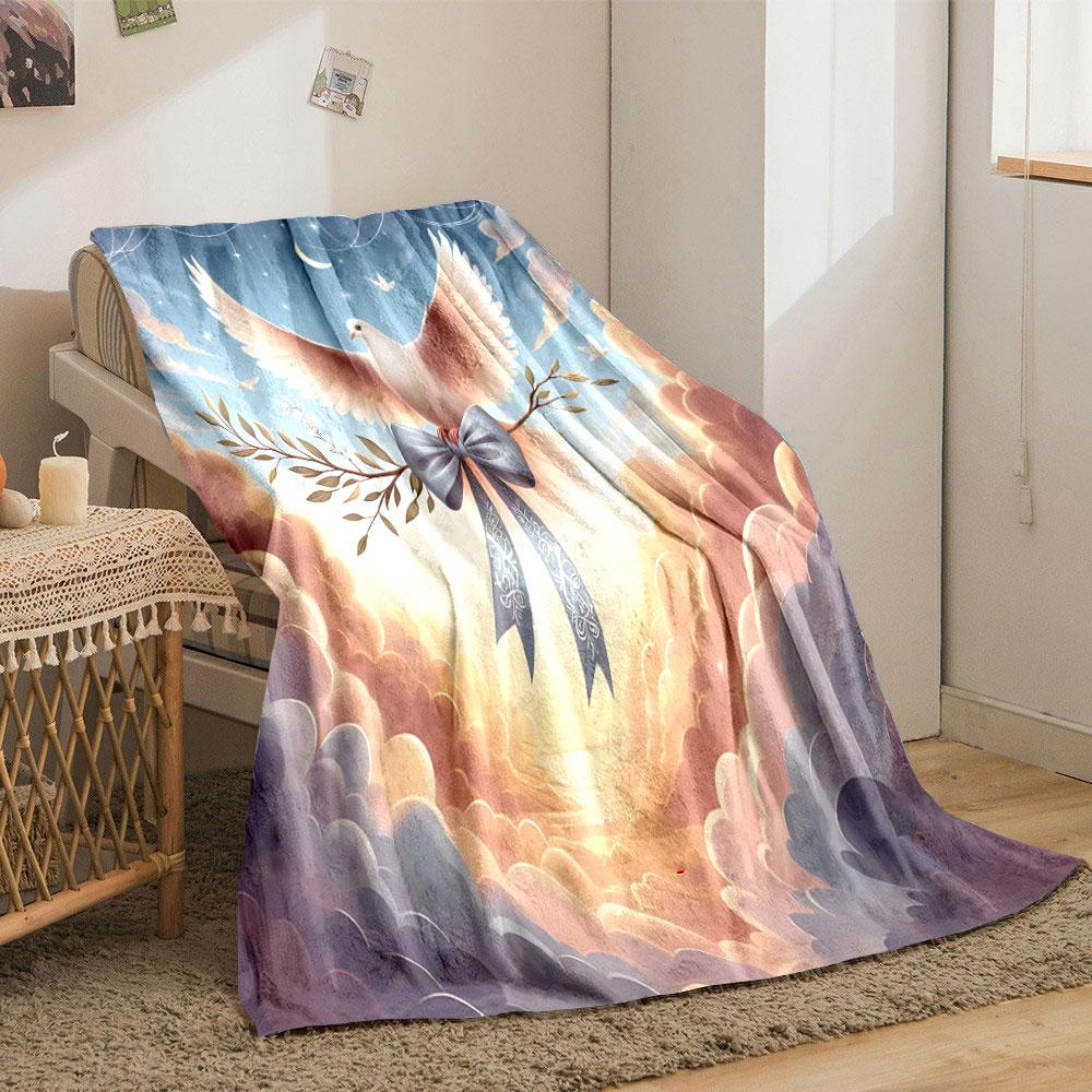 A dove carrying an olive branch with a blue ribbon in a dreamy sky. for all seasons blanket lunch break throw gift