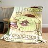 Cute yellow character with brown hat holding donuts, surrounded by sparkles. for all seasons blanket lunch break throw gift