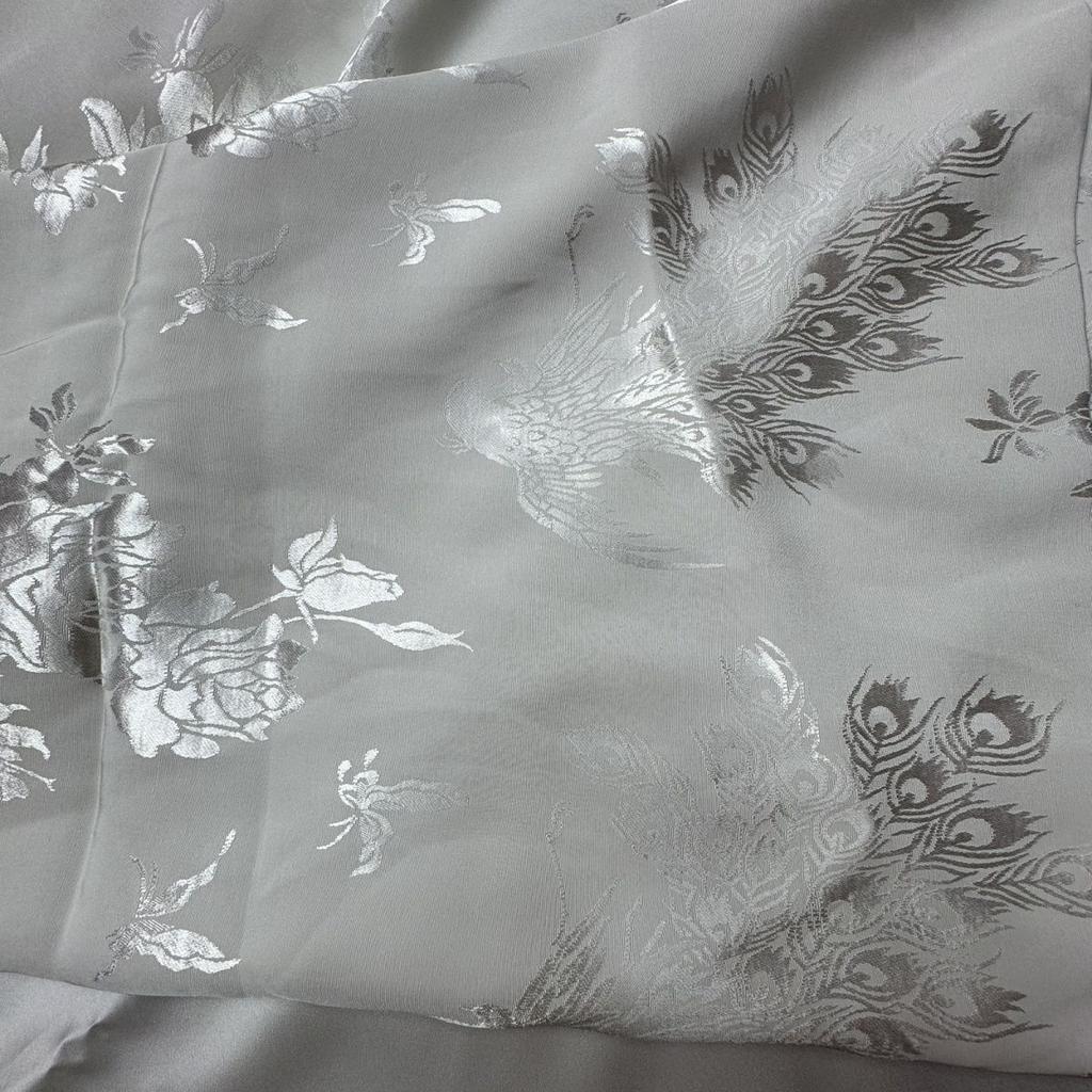 This white heavy-weight peacock and peony jacquard fabric can be used for wedding dresses formal gowns designer clothing fabrics