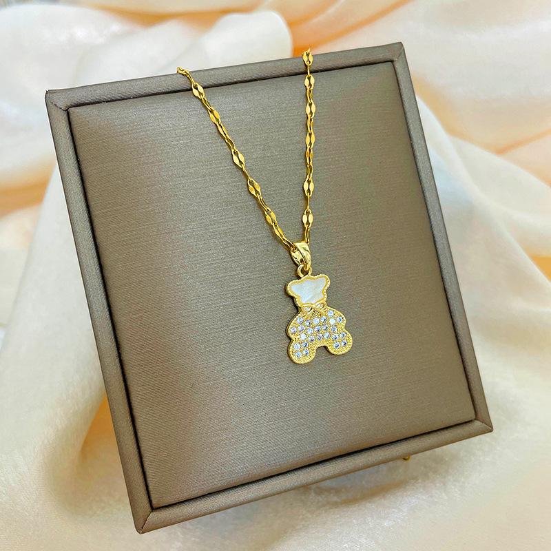 Позолоченная медь 18 карат, цепочка на ключицу с дизайном абака, тыквы-горлянки и лебедя.