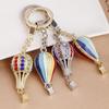 Hot Air Balloon & Hamburger Golden Keychain with Melon Seed Alloy and Sand Gold Ingot