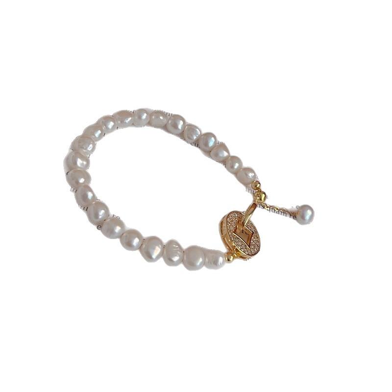 Yuhé Pearl Baroque Bracelet, a brand-new design featuring a money clip for attracting wealth14k Gold-plated for color retention, featuring a unique