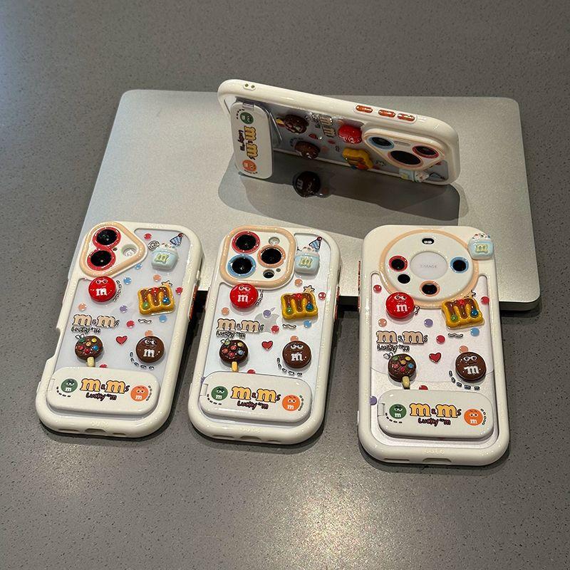 Контрастный цвет Маленькие забавные M&M's Подходит для чехла для мобильного телефона Apple 16 Трехмерный с подставкой Чехол для мобильного телефона iPhone 15 Защита от падений 17