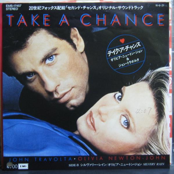 7-дюймовая пластинка JOHN TRAVOLTA OLIVIA NEWTONJOHN Take A Chance Silvery Rain EMS17457PROMO EMI 1984 Япония Поп Б/у