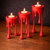 A modern candlestick in the form of "flowing wax" in red.