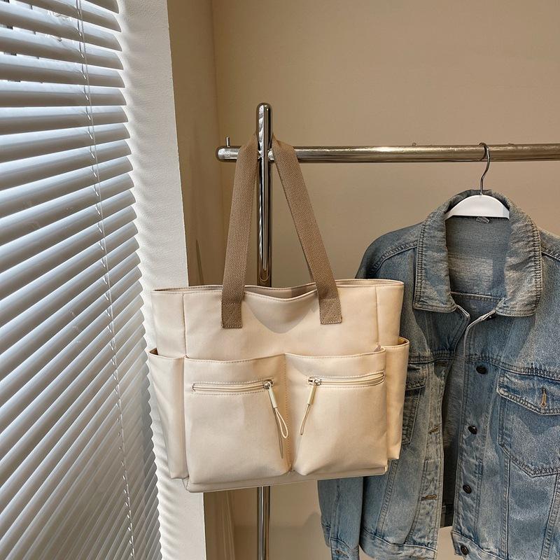 Простая повседневная сумка-тоут в зарубежном стиле, большой вместимости, персонализированная трендовая сумка подмышку, весенняя модная нишевая дизайнерская сумка через плечо