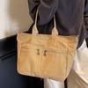 2025 новая сумка-тоут большой вместимости женская нишевый дизайн для поездок на работу двухкарманная холщовая сумка повседневная простая сумка-мессенджер